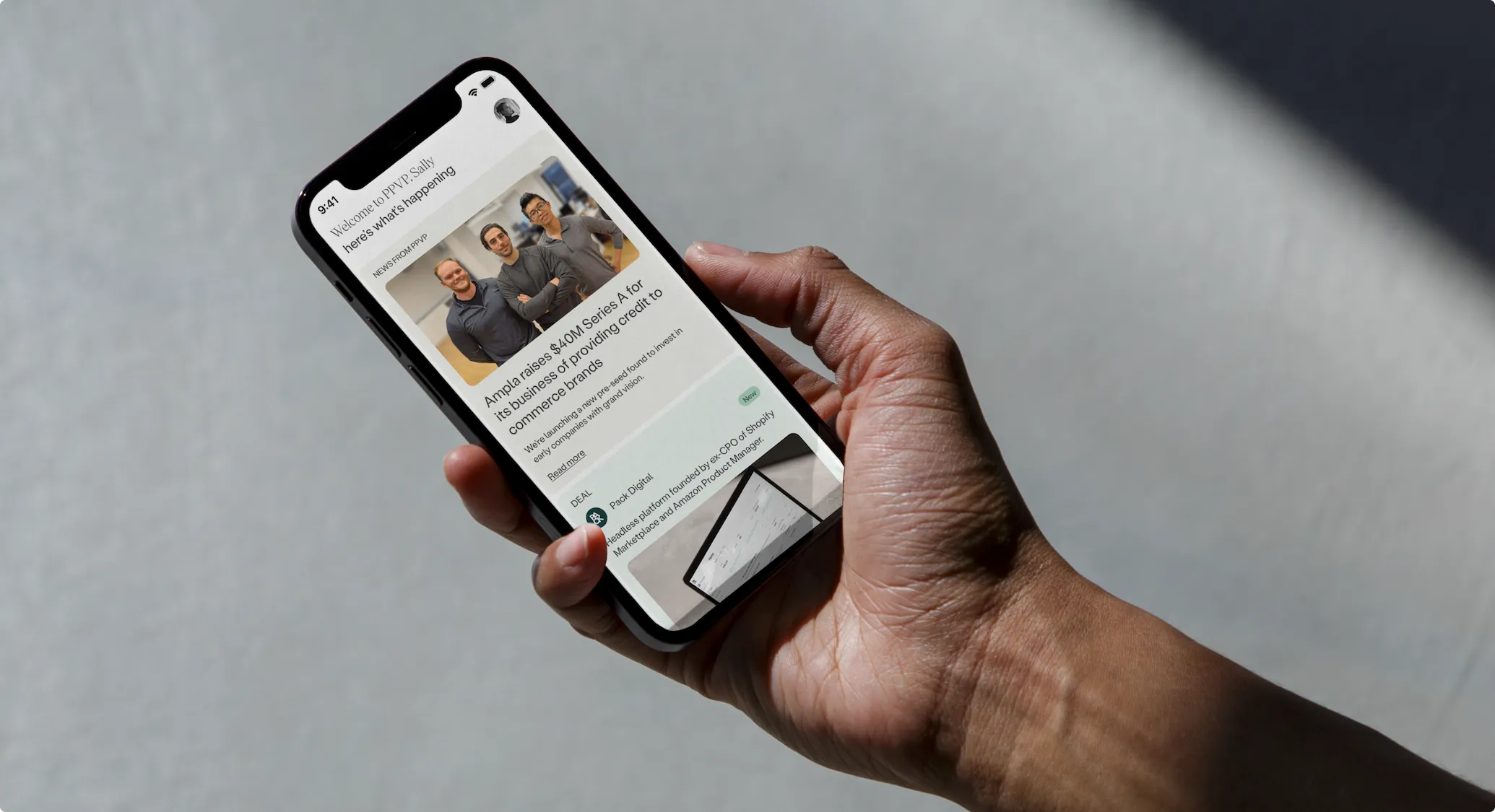 PPVP news feed shown on a phone, held in hand